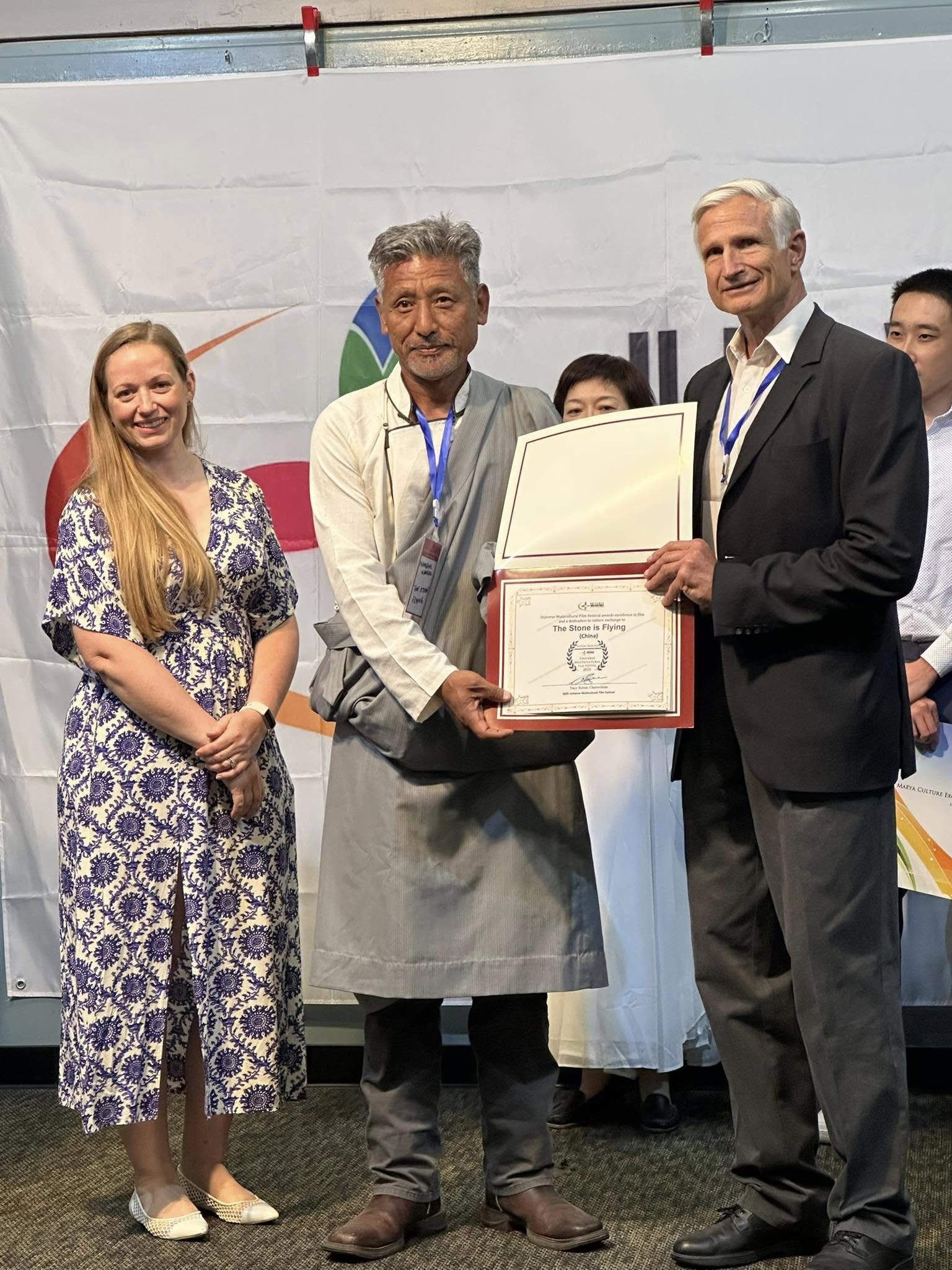 Award presentation on stage at the Universe Multicultural Film Festival